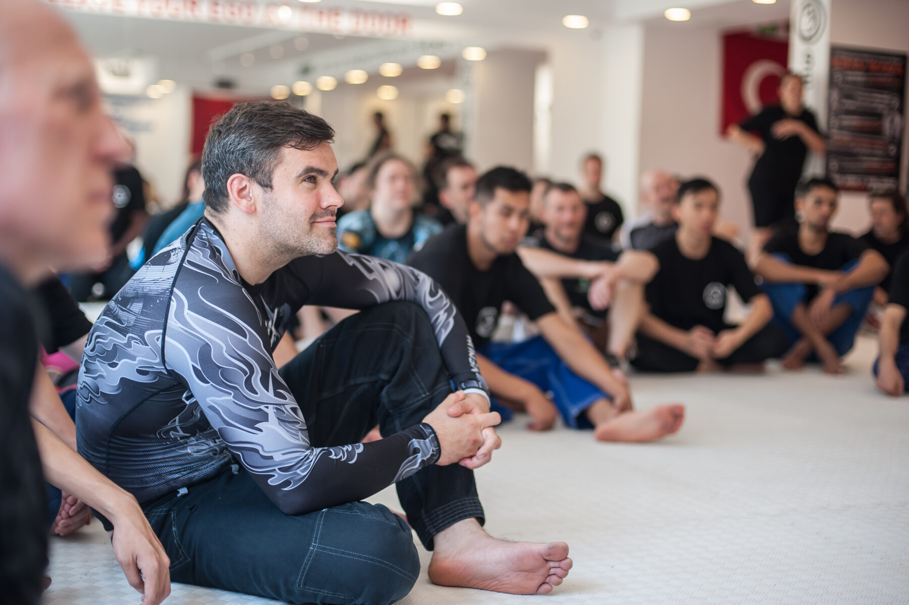 group-of-student-on-martial-arts-seminar-sits-in-dojo