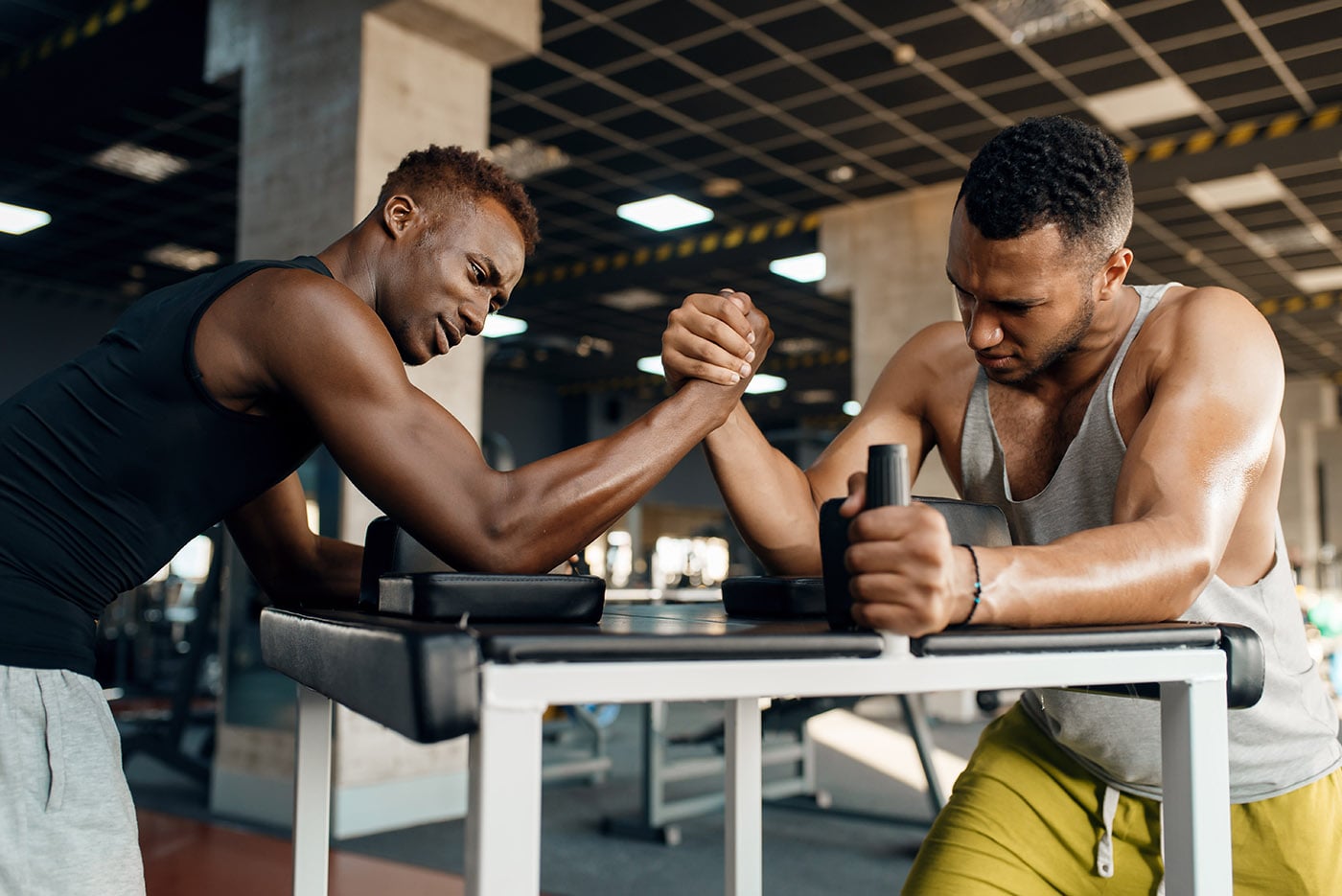 two-men-fighting-arm-wrestling-training-in-gym-cq468dl-min